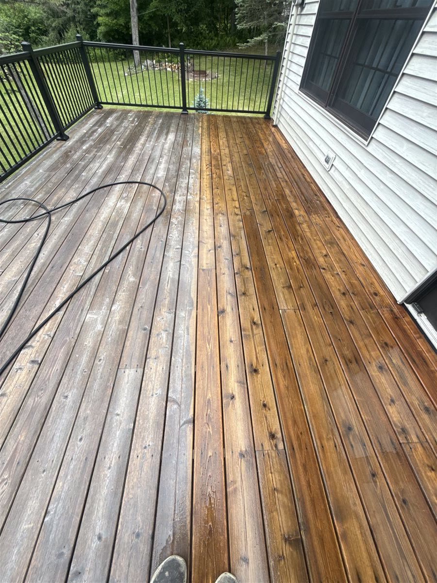 Deck staining transformation — weathered wood beside freshly stained boards