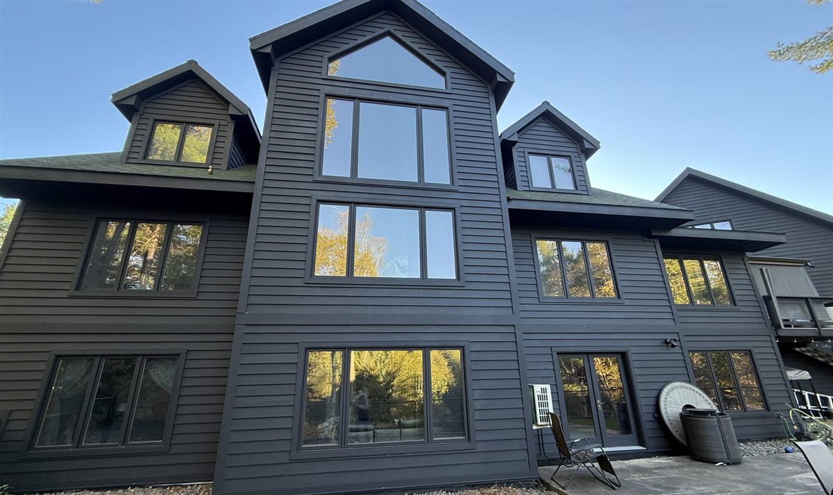 Matte black exterior finish on multi-level home by The Painting Company