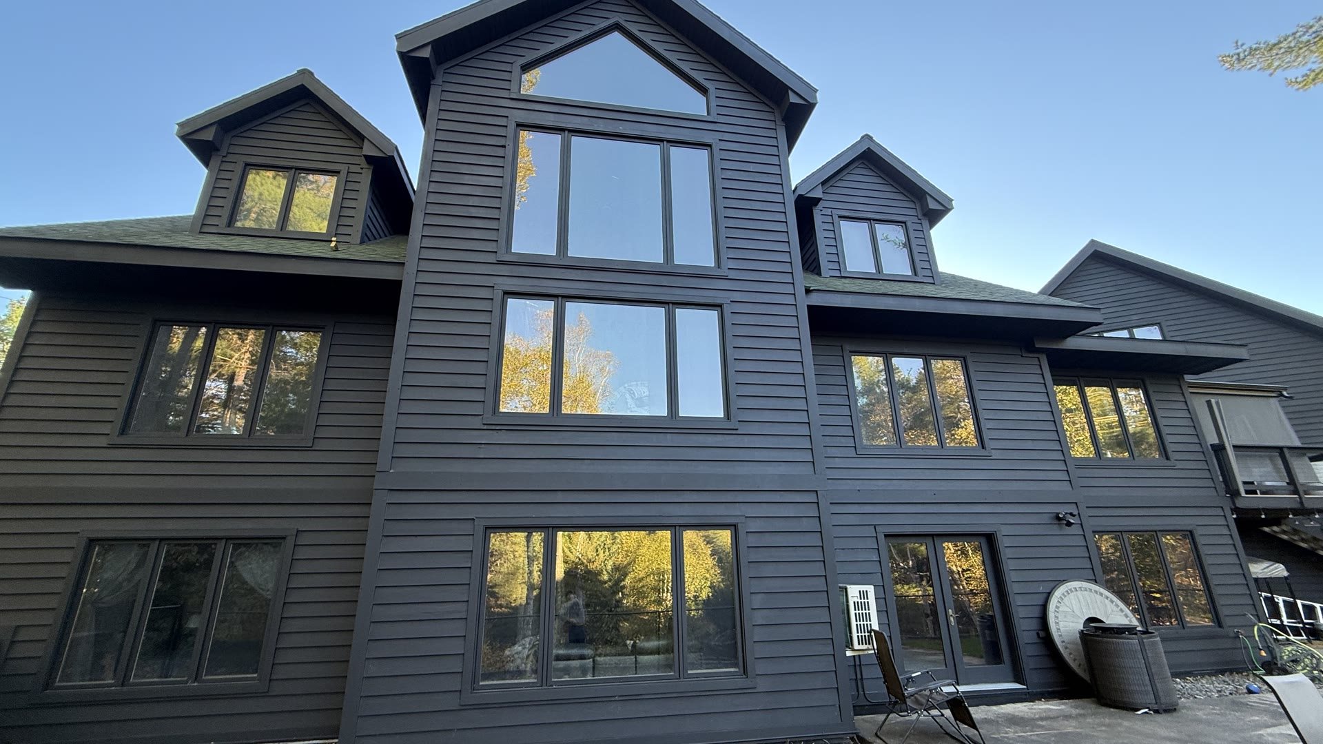 The Painting Company exterior project — charcoal finish on a modern Duluth-area home